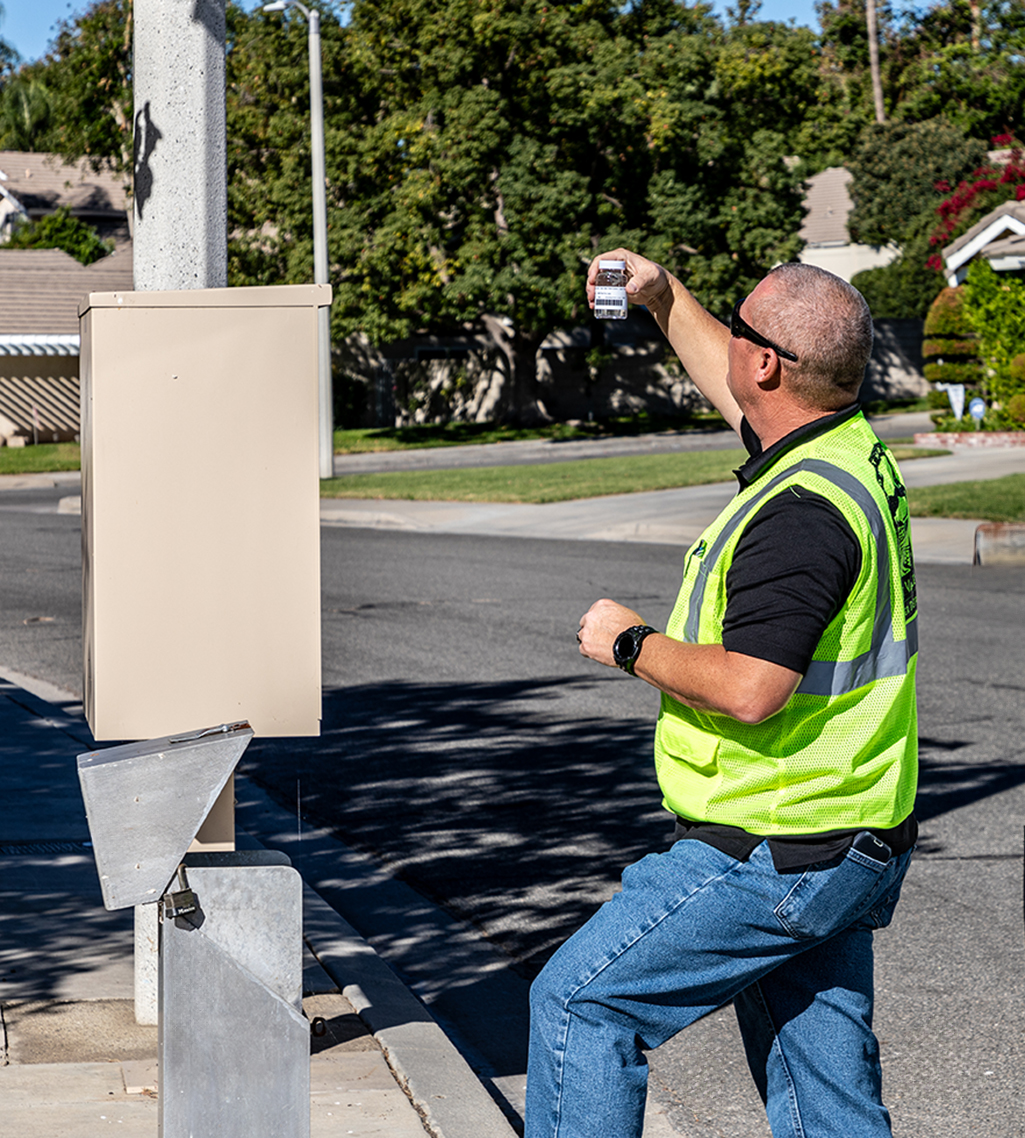 EVWD water quality staff pulling a water sample in the community